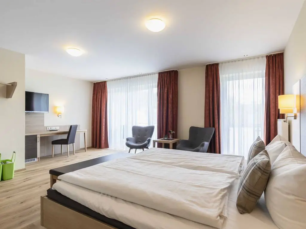 Schlafbereich der Junior Suite Deluxe im Hotel Dirsch
